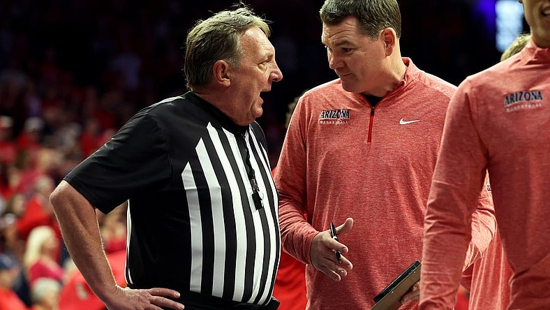 Feb 17, 2024; Tucson, Arizona, USA; Arizona Wildcats head coach Tommy Lloyd talks to the referee during a timeout against the Arizona State Sun Devils during the second half at McKale Center. Mandatory Credit: Zachary BonDurant-USA TODAY Sports