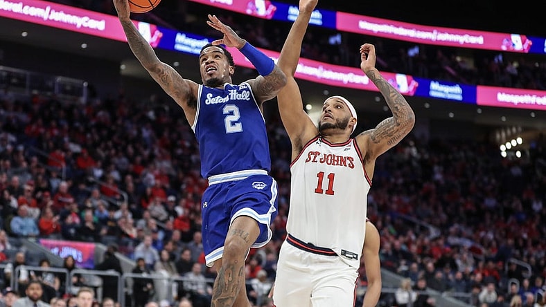 Feb 18, 2024; Elmont, New York, USA;  Seton Hall Pirates guard Al-Amir Dawes (2) drives past St. John's Red Storm center Joel Soriano (11) in the first half at UBS Arena. Mandatory Credit: Wendell Cruz-USA TODAY Sports