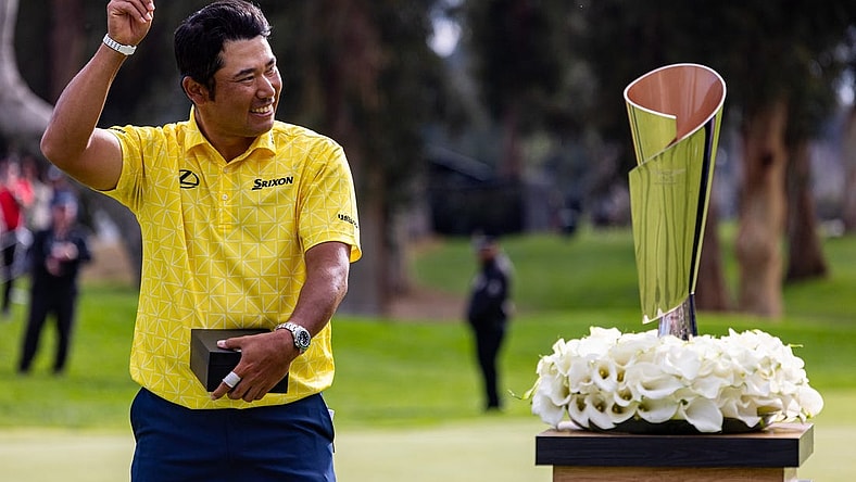 Feb 18, 2024; Pacific Palisades, California, USA; Hideki Matsuyama celebrates after winning The Genesis Invitational golf tournament at Riveria Country Club. Mandatory Credit: Jason Parkhurst-USA TODAY Sports