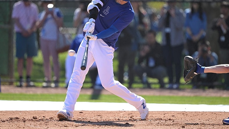 Feb 19, 2024; Glendale, AZ, USA; Los Angeles Dodgers designated hitter Shohei Ohtani (17) takes batting practice during spring training at Camelback Ranch. Mandatory Credit: Jayne Kamin-Oncea-USA TODAY Sports