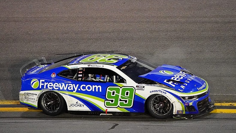 Feb 19, 2024; Daytona Beach, Florida, USA; NASCAR Cup Series driver Daniel Suarez (99) wrecks during the Daytona 500 at Daytona International Speedway. Mandatory Credit: John David Mercer-USA TODAY Sports