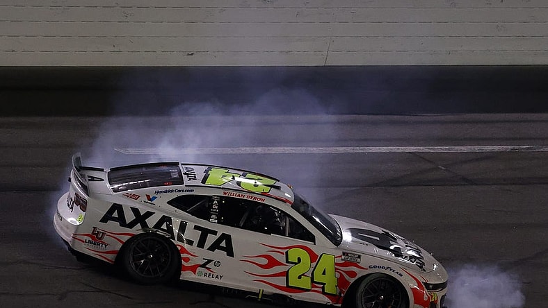 Feb 19, 2024; Daytona Beach, Florida, USA; NASCAR Cup Series driver William Byron (24) does a burn out after winning the Daytona 500 at Daytona International Speedway.  Mandatory Credit: Peter Casey-USA TODAY Sports