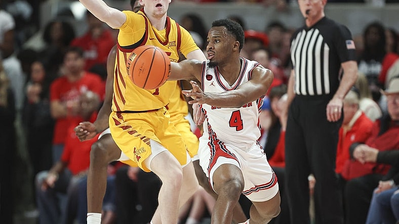 Feb 19, 2024; Houston, Texas, USA; Houston Cougars guard L.J. Cryer (4) passes the ball during the first half against the Iowa State Cyclones at Fertitta Center. Mandatory Credit: Troy Taormina-USA TODAY Sports