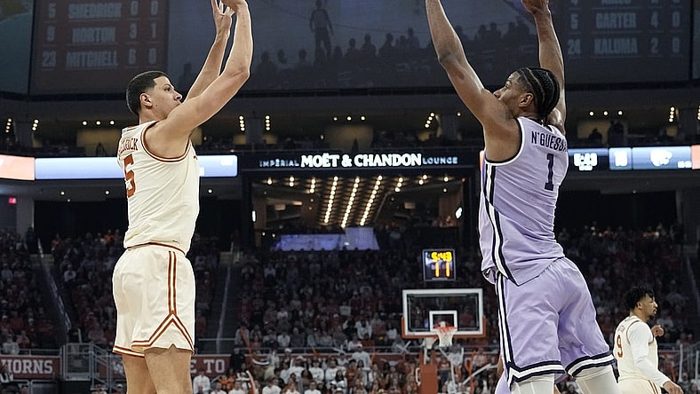 Feb 19, 2024; Austin, Texas, USA; Texas Longhorns forward Kadin Shedrick (5) shoots over Kansas State Wildcats forward David N'Guessan (1) during the first half at Moody Center. Mandatory Credit: Scott Wachter-USA TODAY Sports