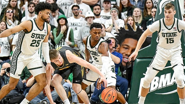 Michigan State's Tyson Walker, right, steals the ball from Iowa's Josh Dix during the first half on Tuesday, Feb. 20, 2024, at the Breslin Center in East Lansing.