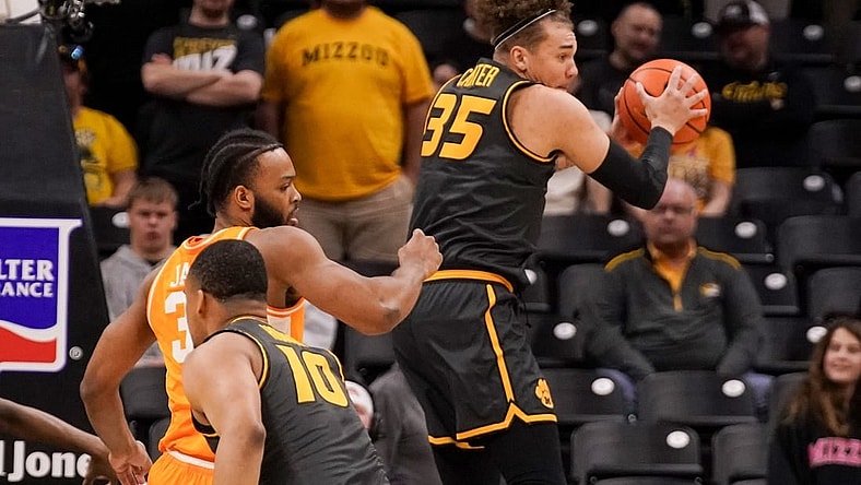 Feb 20, 2024; Columbia, Missouri, USA; Missouri Tigers forward Noah Carter (35) rebounds as Tennessee Volunteers guard Dalton Knecht (3) defends during the first half at Mizzou Arena. Mandatory Credit: Denny Medley-USA TODAY Sports