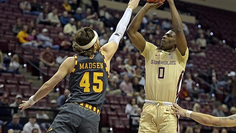 Feb 20, 2024; Tallahassee, Florida, USA; Florida State Seminoles guard Chandler Jackson (0) shoots the ball over Boston College Eagles guard Mason Madsen (45) during the first half at Donald L. Tucker Center. Mandatory Credit: Melina Myers-USA TODAY Sports