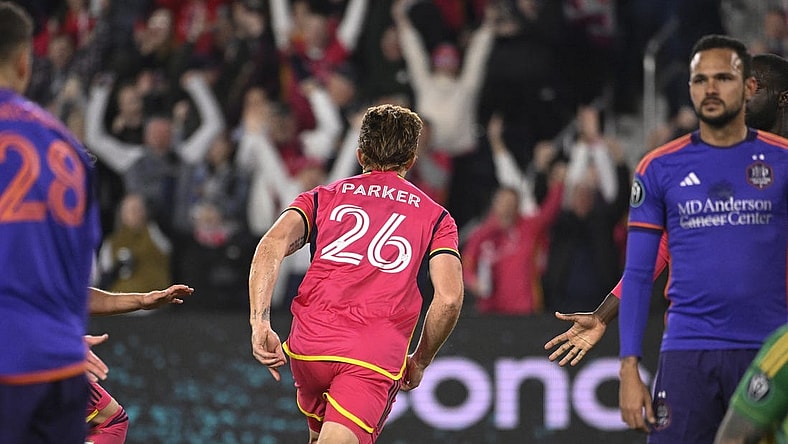 Feb 20, 2024; St. Louis, MO, USA; St. Louis City defender Tim Parker (26) reacts after scoring a goal against the Houston Dynamo during the second half of the CONCACAF Champions Cup-Round One at CITYPARK. Mandatory Credit: Joe Puetz-USA TODAY Sports