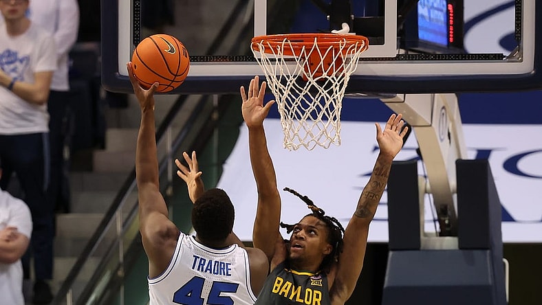 Feb 20, 2024; Provo, Utah, USA; Brigham Young Cougars forward Fousseyni Traore (45) shoots over Baylor Bears guard Jayden Nunn (2) during the second half at Marriott Center. Mandatory Credit: Rob Gray-USA TODAY Sports