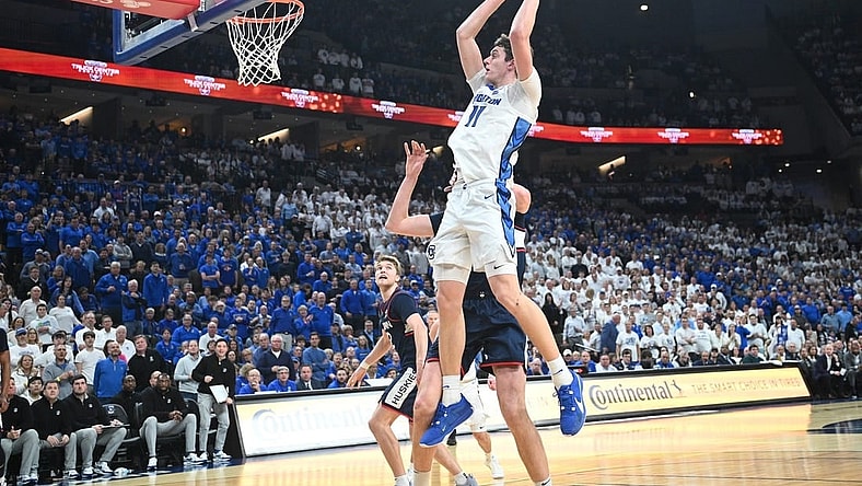 Feb 20, 2024; Omaha, Nebraska, USA; Creighton Bluejays center Ryan Kalkbrenner (11) grabs a pass against the Connecticut Huskies in the second half at CHI Health Center Omaha. Mandatory Credit: Steven Branscombe-USA TODAY Sports