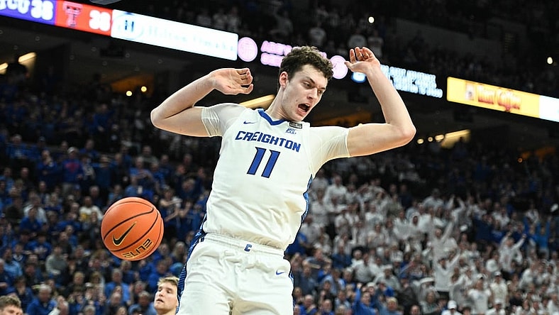 Feb 20, 2024; Omaha, Nebraska, USA; Creighton Bluejays center Ryan Kalkbrenner (11) dunks against the Connecticut Huskies in the second half at CHI Health Center Omaha. Mandatory Credit: Steven Branscombe-USA TODAY Sports