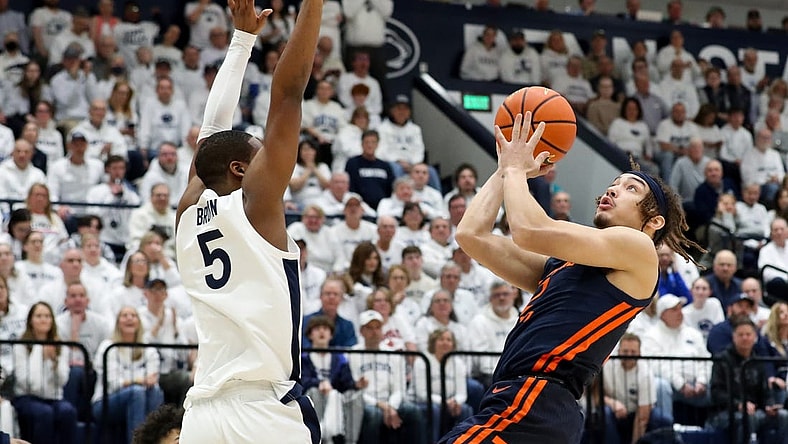 Feb 21, 2024; University Park, Pennsylvania, USA; Illinois Fighting Illini guard Dra Gibbs-Lawhorn (2) drives against Penn State Nittany Lions guard Jameel Brown (5) during the first half at Rec Hall. Mandatory Credit: Matthew O'Haren-USA TODAY Sports