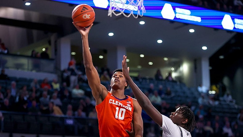 Feb 21, 2024; Atlanta, Georgia, USA; Clemson Tigers forward RJ Godfrey (10) shoots past Georgia Tech Yellow Jackets forward Baye Ndongo (11) in the first half at McCamish Pavilion. Mandatory Credit: Brett Davis-USA TODAY Sports
