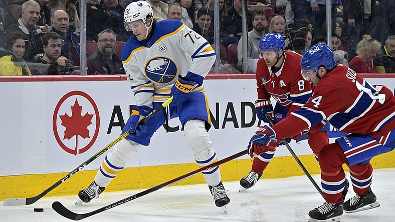 Feb 21, 2024; Montreal, Quebec, CAN; Buffalo Sabres forward Tage Thompson (72) plays the puck and Montreal Canadiens forward Nick Suzuki (14) defends during the second period at the Bell Centre. Mandatory Credit: Eric Bolte-USA TODAY Sports