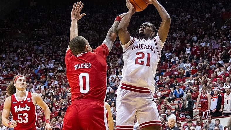 Feb 21, 2024; Bloomington, Indiana, USA; Indiana Hoosiers forward Mackenzie Mgbako (21) shoots the ball while Nebraska Cornhuskers guard C.J. Wilcher (0) defends in the first half at Simon Skjodt Assembly Hall. Mandatory Credit: Trevor Ruszkowski-USA TODAY Sports