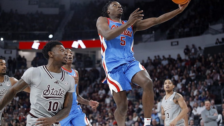 Feb 21, 2024; Starkville, Mississippi, USA; Mississippi Rebels guard Jaylen Murray (5) shoots during the first half against the Mississippi State Bulldogs at Humphrey Coliseum. Mandatory Credit: Petre Thomas-USA TODAY Sports
