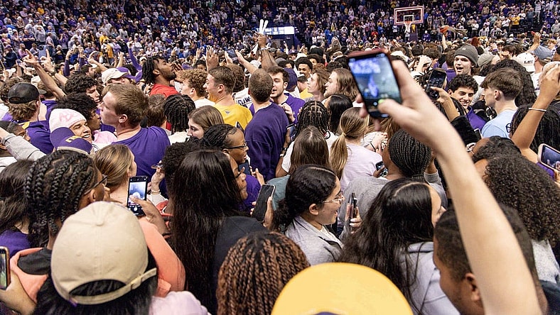 Feb 21, 2024; Baton Rouge, Louisiana, USA; LSU Tigers storm the court after the LSU Tigers defeat the Kentucky Wildcats after the game at Pete Maravich Assembly Center. Mandatory Credit: Stephen Lew-USA TODAY Sports