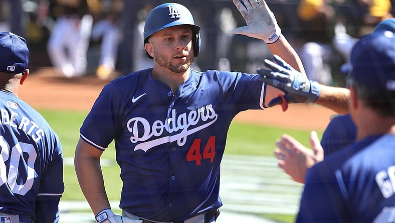 Feb 22, 2024; Peoria, Arizona, USA; Los Angeles Dodgers infielder Kevin Padlo celebrates with teammates after hitting a home run against the San Diego Padres during a spring training game at Peoria Sports Complex. Mandatory Credit: Mark J. Rebilas-USA TODAY Sports