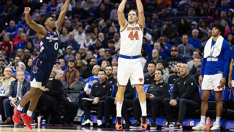 Feb 22, 2024; Philadelphia, Pennsylvania, USA; New York Knicks forward Bojan Bogdanovic (44) scores a three pointer in front of Philadelphia 76ers guard Tyrese Maxey (0) during the second quarter at Wells Fargo Center. Mandatory Credit: Bill Streicher-USA TODAY Sports