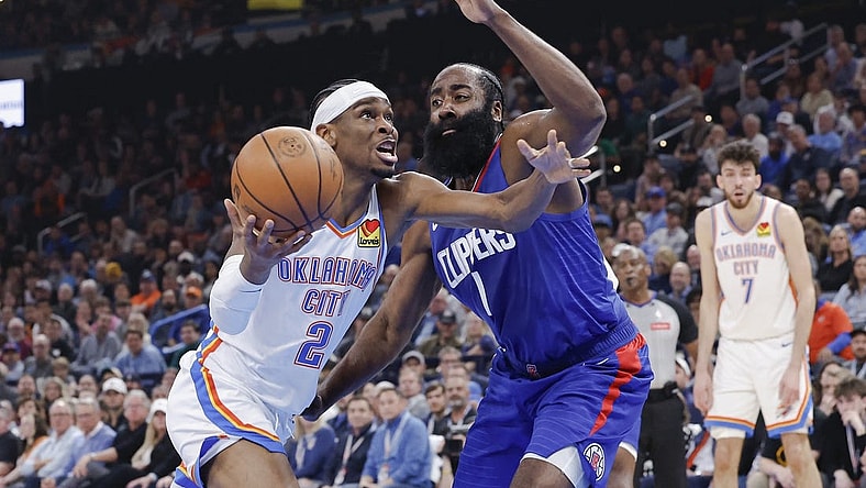 Feb 22, 2024; Oklahoma City, Oklahoma, USA; Oklahoma City Thunder guard Shai Gilgeous-Alexander (2) moves to the basket beside LA Clippers guard James Harden (1) during the second quarter at Paycom Center. Mandatory Credit: Alonzo Adams-USA TODAY Sports