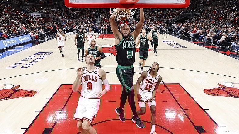 Feb 22, 2024; Chicago, Illinois, USA; Boston Celtics guard Derrick White (9) dunks the ball against the Chicago Bulls during the first half at United Center. Mandatory Credit: Kamil Krzaczynski-USA TODAY Sports