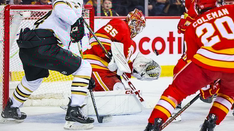 Feb 22, 2024; Calgary, Alberta, CAN; Calgary Flames goaltender Jacob Markstrom (25) makes a save against the Boston Bruins during the first period at Scotiabank Saddledome. Mandatory Credit: Sergei Belski-USA TODAY Sports