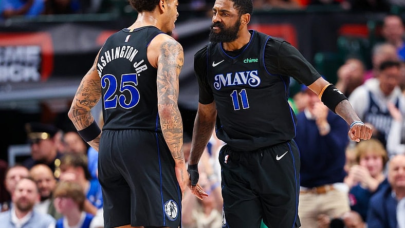 Feb 22, 2024; Dallas, Texas, USA;  Dallas Mavericks guard Kyrie Irving (11) celebrates with Dallas Mavericks forward P.J. Washington (25) during the second half against the Phoenix Suns at American Airlines Center. Mandatory Credit: Kevin Jairaj-USA TODAY Sports
