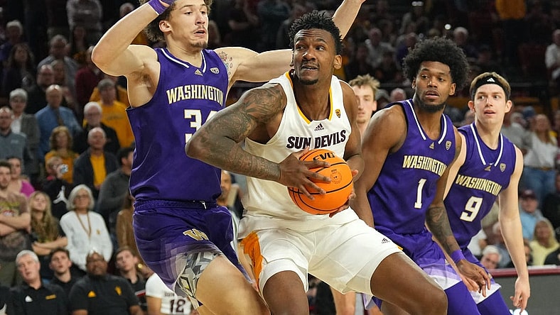 Feb 22, 2024; Tempe, Arizona, USA; Arizona State Sun Devils center Shawn Phillips Jr. (9) works under the basket against Washington Huskies center Braxton Meah (34) during the second half at Desert Financial Arena. Mandatory Credit: Joe Camporeale-USA TODAY Sports