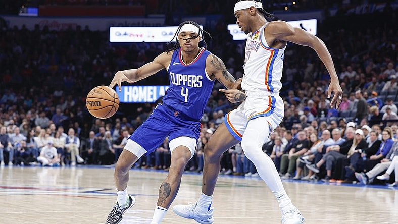 Feb 22, 2024; Oklahoma City, Oklahoma, USA; Oklahoma City Thunder guard Shai Gilgeous-Alexander (2) defends a drive by LA Clippers guard Brandon Boston Jr. (4) during the second half at Paycom Center. Mandatory Credit: Alonzo Adams-USA TODAY Sports