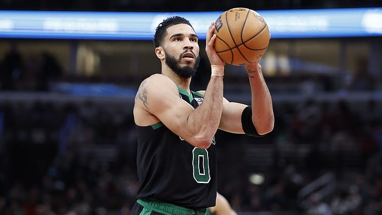 Feb 22, 2024; Chicago, Illinois, USA; Boston Celtics forward Jayson Tatum (0) shoots a free throw against the Chicago Bulls during the second half at United Center. Mandatory Credit: Kamil Krzaczynski-USA TODAY Sports