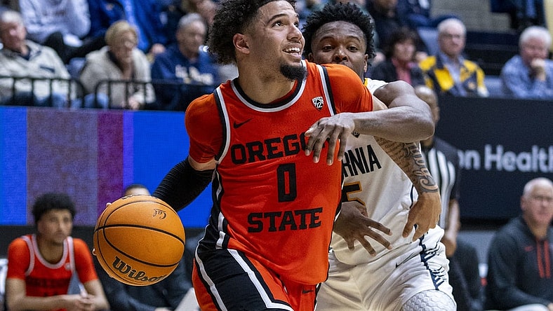 February 22, 2024; Berkeley, California, USA; Oregon State Beavers guard Jordan Pope (0) dribbles the basketball against California Golden Bears guard Jalen Cone (15) during the second half at Haas Pavilion. Mandatory Credit: Kyle Terada-USA TODAY Sports