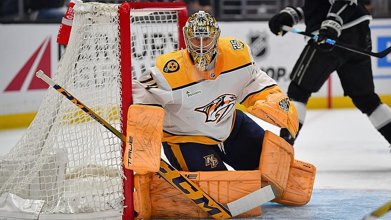 Feb 22, 2024; Los Angeles, California, USA; Nashville Predators goaltender Juuse Saros (74) defends the goal against the Los Angeles Kings during the second period at Crypto.com Arena. Mandatory Credit: Gary A. Vasquez-USA TODAY Sports