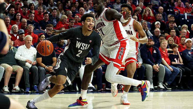 Feb 22, 2024; Tucson, Arizona, USA; Washington State Cougars guard Myles Rice (2) drives to the net against Arizona Wildcats center Oumar Ballo (11) during the first half at McKale Center. Mandatory Credit: Zachary BonDurant-USA TODAY Sports
