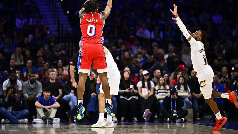 Feb 23, 2024; Philadelphia, Pennsylvania, USA; Philadelphia 76ers guard Tyrese Maxey (0) shoots against Cleveland Cavaliers guard Darius Garland (10) in the first quarter at Wells Fargo Center. Mandatory Credit: Kyle Ross-USA TODAY Sports