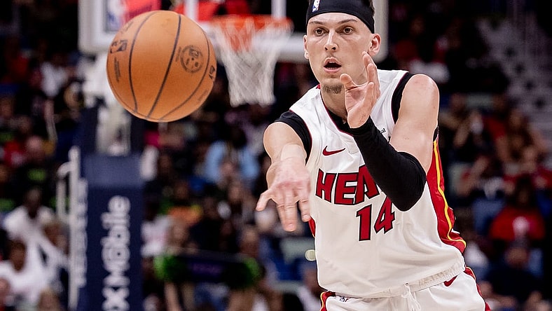 Feb 23, 2024; New Orleans, Louisiana, USA; Miami Heat guard Tyler Herro (14) passes the ball against the New Orleans Pelicans during the first half at Smoothie King Center. Mandatory Credit: Stephen Lew-USA TODAY Sports