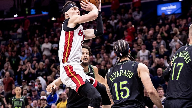 Feb 23, 2024; New Orleans, Louisiana, USA;  Miami Heat guard Tyler Herro (14) shoots a jump shot against the New Orleans Pelicans during the first half at Smoothie King Center. Mandatory Credit: Stephen Lew-USA TODAY Sports