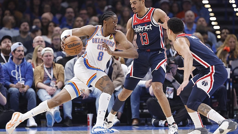 Feb 23, 2024; Oklahoma City, Oklahoma, USA; Oklahoma City Thunder forward Jalen Williams (8) drives to the basket against Washington Wizards guard Jordan Poole (13) during the second quarter at Paycom Center. Mandatory Credit: Alonzo Adams-USA TODAY Sports