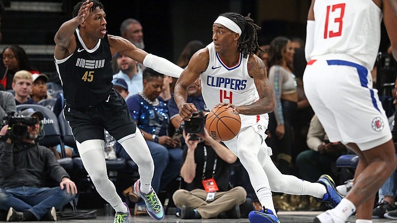 Feb 23, 2024; Memphis, Tennessee, USA; Los Angeles Clippers guard Terance Mann (14) drives to the basket as Memphis Grizzlies forward GG Jackson (45) defends during the first half at FedExForum. Mandatory Credit: Petre Thomas-USA TODAY Sports