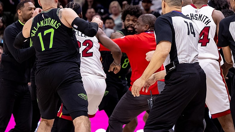 Feb 23, 2024; New Orleans, Louisiana, USA;  Miami Heat forward Jimmy Butler (22) and New Orleans Pelicans forward Naji Marshall (8) and guard Jose Alvarado (15) are ejected after a melee due to a play during the second half at Smoothie King Center. Mandatory Credit: Stephen Lew-USA TODAY Sports