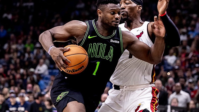 Feb 23, 2024; New Orleans, Louisiana, USA;  New Orleans Pelicans forward Zion Williamson (1) drives to the basket against Miami Heat center Bam Adebayo (13) during the second half at Smoothie King Center. Mandatory Credit: Stephen Lew-USA TODAY Sports