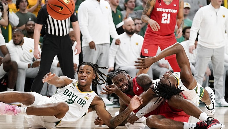 Feb 24, 2024; Waco, Texas, USA; Baylor Bears guard Jayden Nunn (2) and Baylor Bears guard Ja'Kobe Walter (4) battle with Houston Cougars guard Jamal Shead (1) for the loose ball during the first half at Paul and Alejandra Foster Pavilion. Mandatory Credit: Raymond Carlin III-USA TODAY Sports