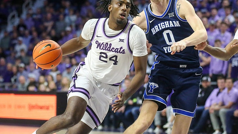 Feb 24, 2024; Manhattan, Kansas, USA; Kansas State Wildcats forward Arthur Kaluma (24) drives to the basket against Brigham Young Cougars forward Noah Waterman (0) duering the first half at Bramlage Coliseum. Mandatory Credit: Scott Sewell-USA TODAY Sports