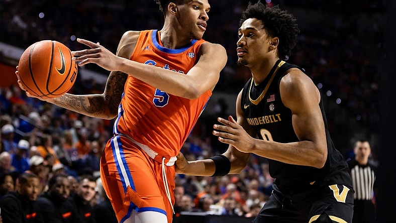 Feb 24, 2024; Gainesville, Florida, USA; Florida Gators guard Will Richard (5) looks to drive at Vanderbilt Commodores guard Tyrin Lawrence (0) during the second half at Exactech Arena at the Stephen C. O'Connell Center. Mandatory Credit: Matt Pendleton-USA TODAY Sports