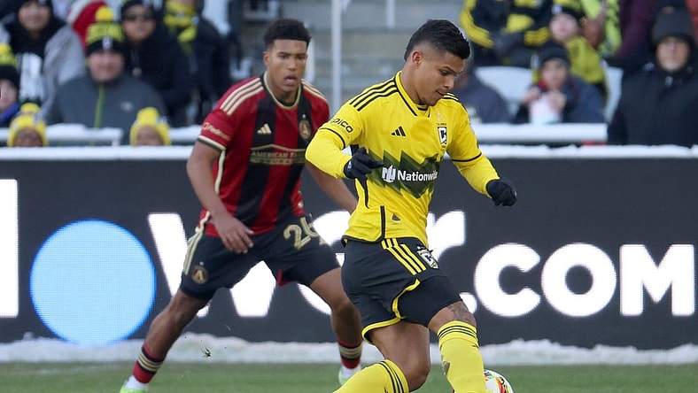 Feb 24, 2024; Columbus, Ohio, USA; Columbus Crew forward Cucho Hernandez (9) dribbles the ball past Atlanta United defender Caleb Wiley (26) during the first half at Lower.com Field. Mandatory Credit: Trevor Ruszkowski-USA TODAY Sports