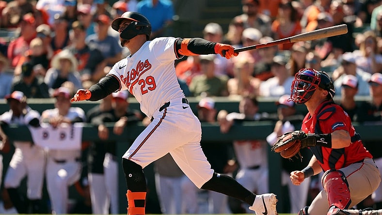 Feb 24, 2024; Sarasota, Florida, USA; Baltimore Orioles third baseman Ramon Urias (29) hits a sacrifice RBI during the fourth inning against the Boston Red Sox at Ed Smith Stadium. Mandatory Credit: Kim Klement Neitzel-USA TODAY Sports