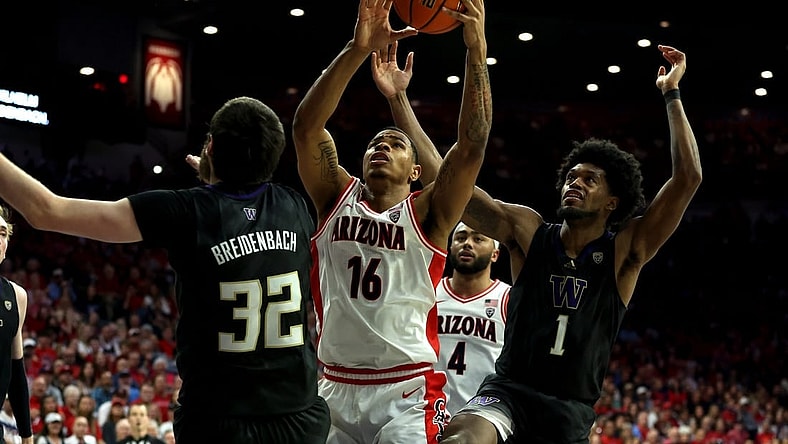 Feb 24, 2024; Tucson, Arizona, USA; Arizona Wildcats forward Keshad Johnson (16) gets a rebound against Washington Huskies forward Wilhelm Breidenbach (32) and forward Keion Brooks Jr. (1) during the second half at McKale Center. Mandatory Credit: Zachary BonDurant-USA TODAY Sports