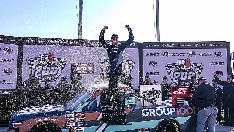 Feb 24, 2024; Hampton, Georgia, USA; NASCAR Craftsman Truck Series Driver Kyle Busch celebrates in victory lane after winning the Fr8 208 at Atlanta Motor Speedway. Mandatory Credit: David Yeazell-USA TODAY Sports