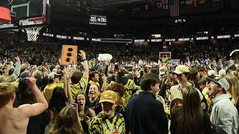 Feb 24, 2024; Winston-Salem, North Carolina, USA;  Wake Forest Demon Deacons students storm the court after Wake Forest wins at Lawrence Joel Veterans Memorial Coliseum. Mandatory Credit: Cory Knowlton-USA TODAY Sports