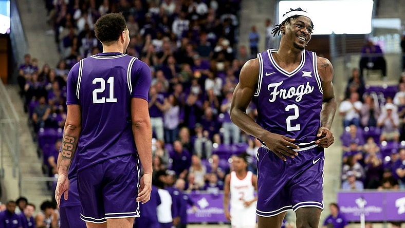 Feb 24, 2024; Fort Worth, Texas, USA; TCU Horned Frogs forward Emanuel Miller (2) celebrates with TCU Horned Frogs forward JaKobe Coles (21) during the second half against the Cincinnati Bearcats at Ed and Rae Schollmaier Arena. Mandatory Credit: Kevin Jairaj-USA TODAY Sports