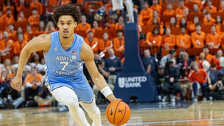 Feb 24, 2024, in Charlottesville, Virginia, USA; North Carolina Tar Heels guard Seth Trimble (7) dribbles against the Virginia Cavaliers at John Paul Jones Arena. Mandatory Credit: Hannah Pajewski-USA TODAY Sports